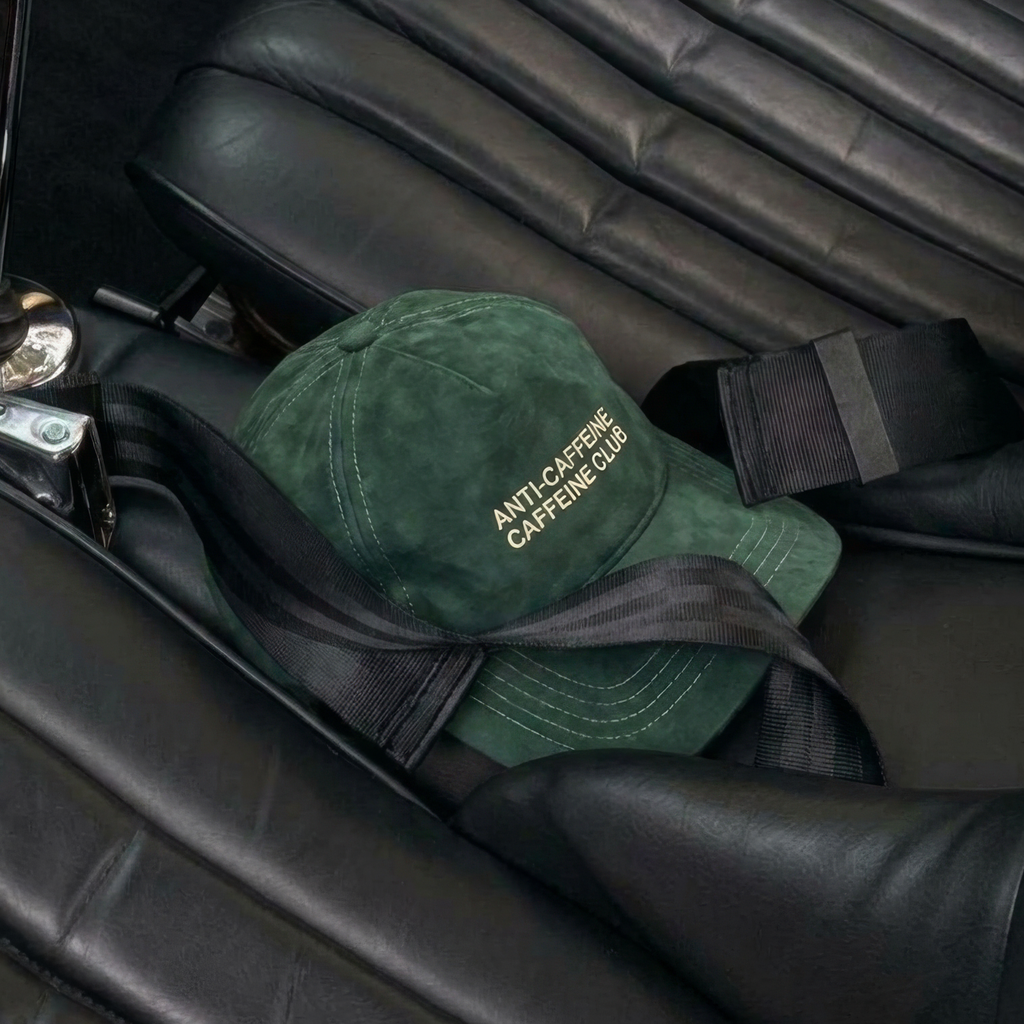 Green cap with text on a car seat